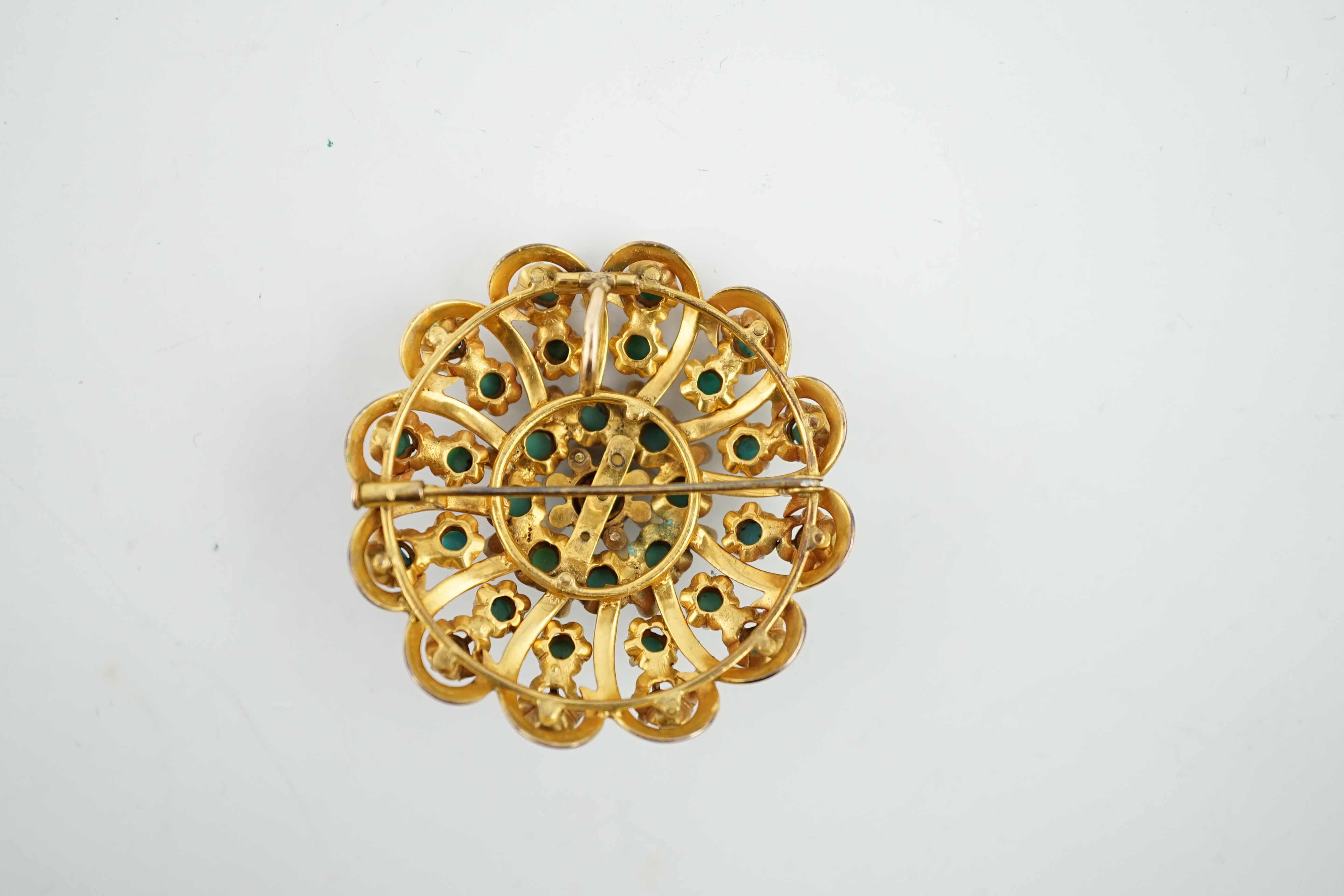 An early to mid 20th century gold, turquoise and blue enamel set whorl pendant brooch